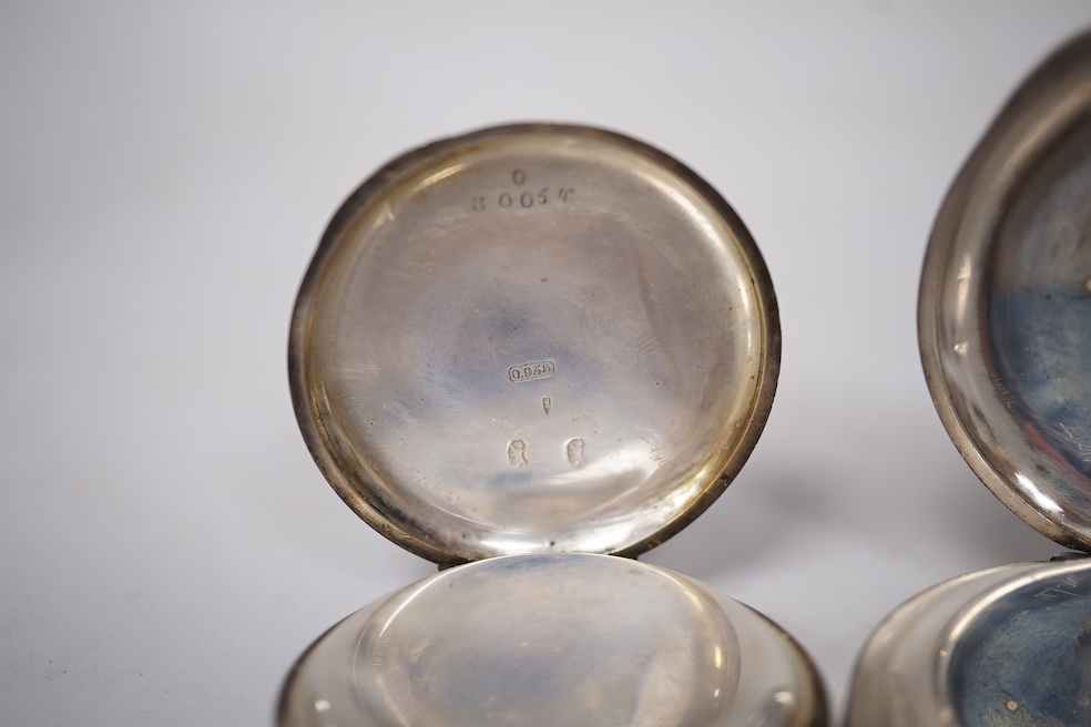 Three early to mid 20th century silver open faced pocket watches, with Roman or Arabic dials and subsidiary seconds, including two keyless and one key wind (Admiral Tacy Watch Co), together with one smaller silver open f